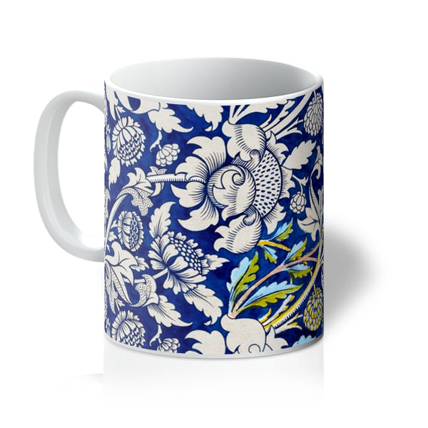 The William Morris mug, 'Wey,' is an iconic blue botanical nature-inspired design by arts and crafts designer William Morris. A perfect gift for tea and coffee lovers, and ideal for your coffee table at home